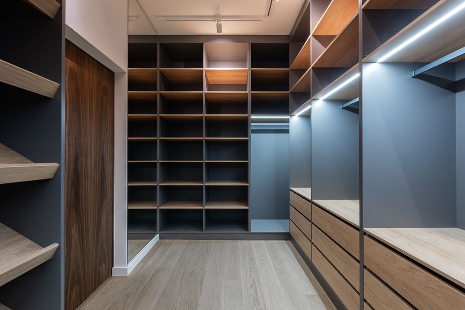 Beautifully organized walk-in closet drawers and shelving