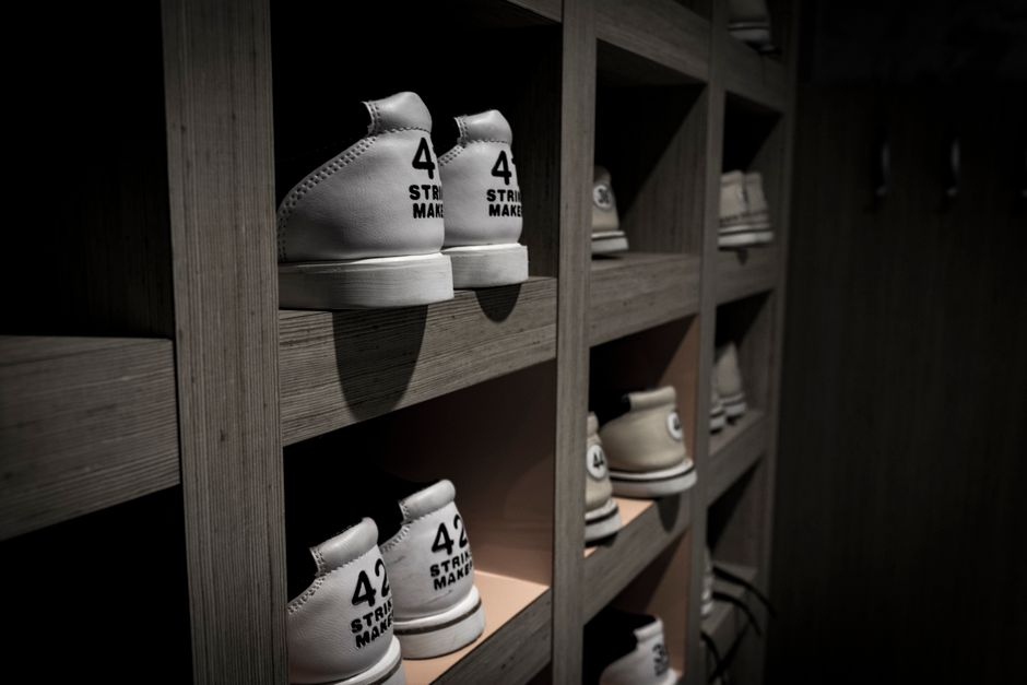 Shoes perfectly aligned on a custom closet shelf